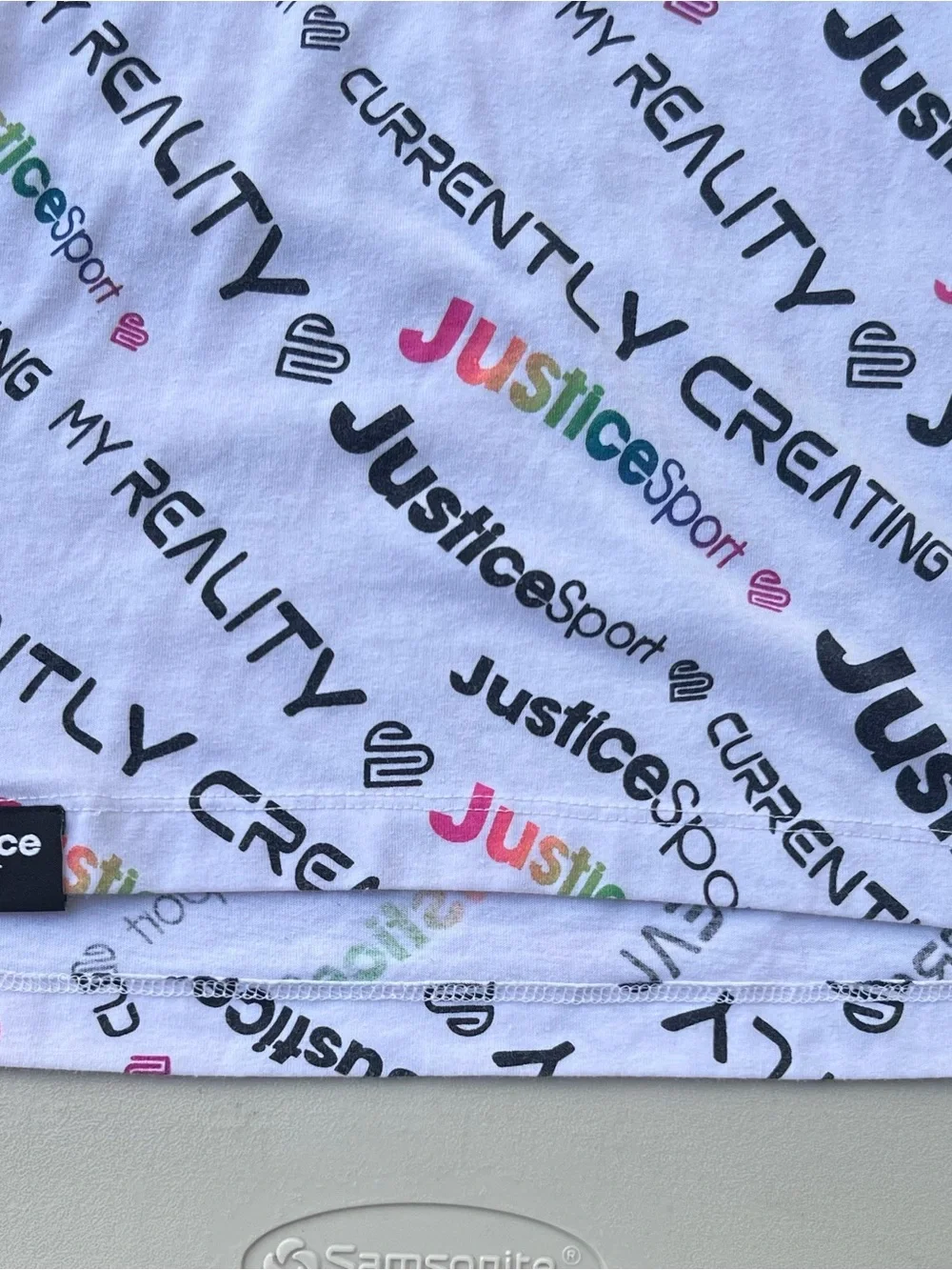 Justice White Tee with Black Trim and Multicolor Logo Print